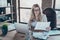 Photo of beautiful blond business lady resourceful person looking seriously hold statistics paper notebook table sitting