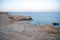 Photo of beautiful clear turquoise sea ocean water surface with ripples low waves on seascape sand beach background