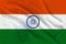 Photo of the beautiful colored national flag of the modern state of India on textured fabric, concept of tourism, economics and