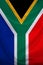 Photo of the beautiful colored national vertical flag of the state of South Africa on textured fabric, concept of tourism, economy