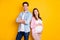 Photo of beautiful family waiting baby mommy hugging tummy father arms crossed isolated yellow color background