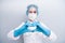 Photo of beautiful lady doc hospital making arms fingers heart figure good mood cardiac safety concept wear gloves mask