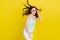 Photo of beautiful stunning female with flying hair enjoy summer holidays isolated on yellow color background