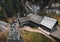 Photo of a beautiful wooden cabin with river in the forest from above - Mlyny Oblazy Slovakia - taken by drone. Old wooden mill