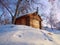 Photo of beautiful wooden outhouse with roof under the snow