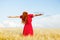 Photo of beautiful young woman on the wonderful wheat field back