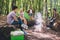 Photo of best friends happy positive smile campfire speak talk rest relax adventure trip camping hiking outdoors