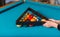 Photo of a billiard table with all items arranged by someone
