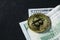 Photo bitcoin on dollar bills