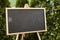 A photo of a blackboard with a hashtag drawned on it outside