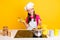 Photo of blogger show participant girl cook perfect al dente pasta wear glove apron cap isolated yellow color background