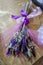 Photo of a bouquet of dried flowers. lilac color scheme. hand made. bouquet on the table with a purple ribbon