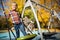 Photo of boy swinging on swing on autumn afternoon