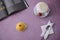 Photo of breakfast on a pink background. Latte coffee and a chic yellow dessert in coconut. Dessert spoon. Elegant layout of food.