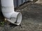 Photo of broken white 6 inch pvc pipe for water drainage.