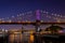 Photo of the Brooklyn Bridge and the Manhattan Bridge in the distance in the evening in New York City