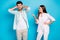 Photo of brown haired couple argument conflict man cover ears woman point finger isolated on blue color background