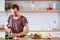 Photo of brunet cooking vegetables on table