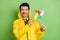 Photo of brunet impressed guy point toy wear cloak isolated on green color background