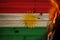 Photo of burning national flag of kurdistan state, rojava closeup, concept of state crisis, destruction, illustration