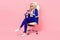 Photo of business lady recruiter sit office armchair hold telephone send email vacancy recruit isolated pink color