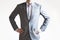 Photo of a businessman in grey suit standing in confident pose o