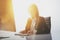 Photo of businesswoman working at table in white television newsroom. White background