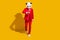 Photo of busy reliable panda guy walk look watch wear mask red suit tie sneakers isolated on yellow color background