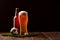 Photo of buttle and glass of beer, soccer ball on green grass