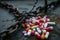 A photo capturing several pills neatly arranged on top of a chain, illustrating the intersection of medication and security, A