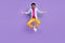 Photo of carefree funny guy jump raise hands weekend free time wear blue shirt isolated purple color background