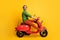 Photo of careless guy ride motorcycle have fun wear specs green sweater trousers footwear isolated yellow color