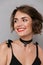 Photo of caucasian woman 20s wearing black dress smiling and loo