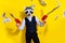 Photo of charismatic authentic guy racoon mask shoot pistol profit money sale trendy party look isolated over yellow