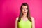 Photo of charming amazed young long brunette hairstyle woman open mouth look empty space wear top isolated on vivid pink