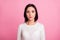 Photo of charming business lady with clever eyes attentively look on camera wear white pullover isolated pink color