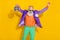 Photo of charming cool man wear purple velvet jacket rising discotheque ball having fun isolated yellow color background