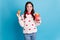 Photo of charming cute young lady wear hearts print sweater eating fast food potato burger isolated blue color