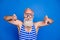 Photo of charming funky elderly man diving wear goggles swim wear bathing costume isolated on blue color background