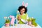 Photo of charming good mood lady celebrate easter holiday prepare for eggs hunt isolated on blue color background