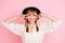 Photo of charming lady two hands show v-sign white smile wear retro cap dotted blouse isolated pink color background