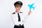 Photo of charming pilot girl hold blue paper plane wear aviator headwear uniform isolated white color background