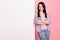 Photo of charming pretty attractive young woman crossed hands banner empty space isolated on pink color background