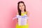 Photo of charming shiny preteen school girl wear yellow clothes smiling holding birthday gift isolated pink color