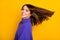 Photo of charming shiny young woman wear purple pullover smiling air blowing hair isolated yellow color background