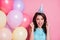 Photo of charming shocked lady festive event birthday party many balloons surprise holiday raise fists overjoyed scream