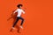 Photo of charming sweet guy wear white shirt jumping high running fast empty space isolated orange color background