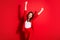 Photo of charming young girl crazy raise two hands knee scream eyes closed wear blazer isolated red color background