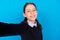 Photo of cheerful beautiful smart intelligent schoolgirl take selfie wear spectacles isolate on blue color background