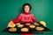 Photo of cheerful boy demonstrate tray cookies wear deer ornament sweater isolated green color background